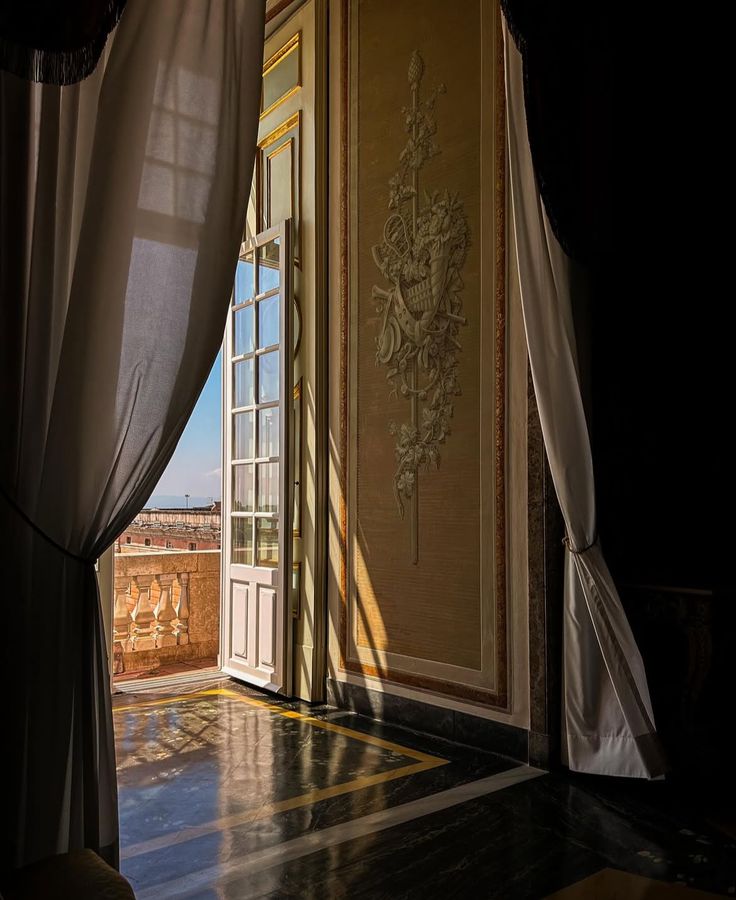 Sunlit palazzo doorway with drawn curtains